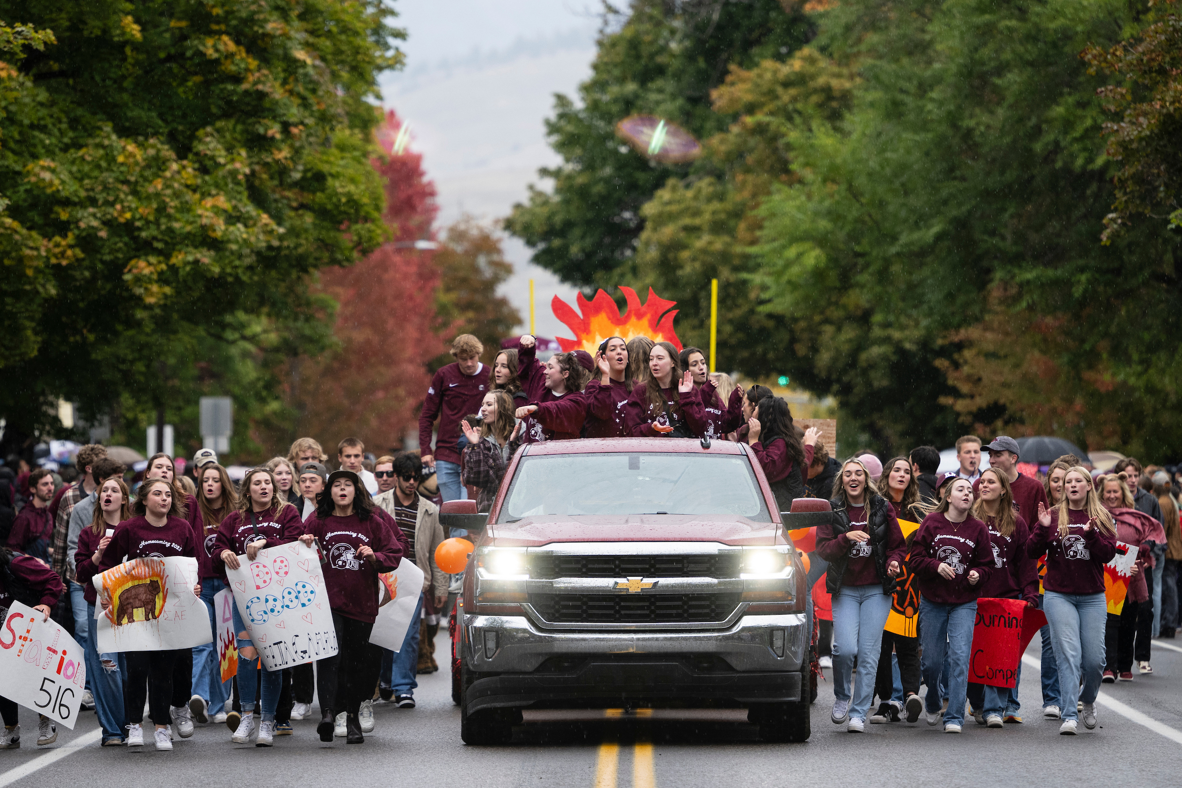 Group of spirited Griz fans walking in the Homecoming Parade.