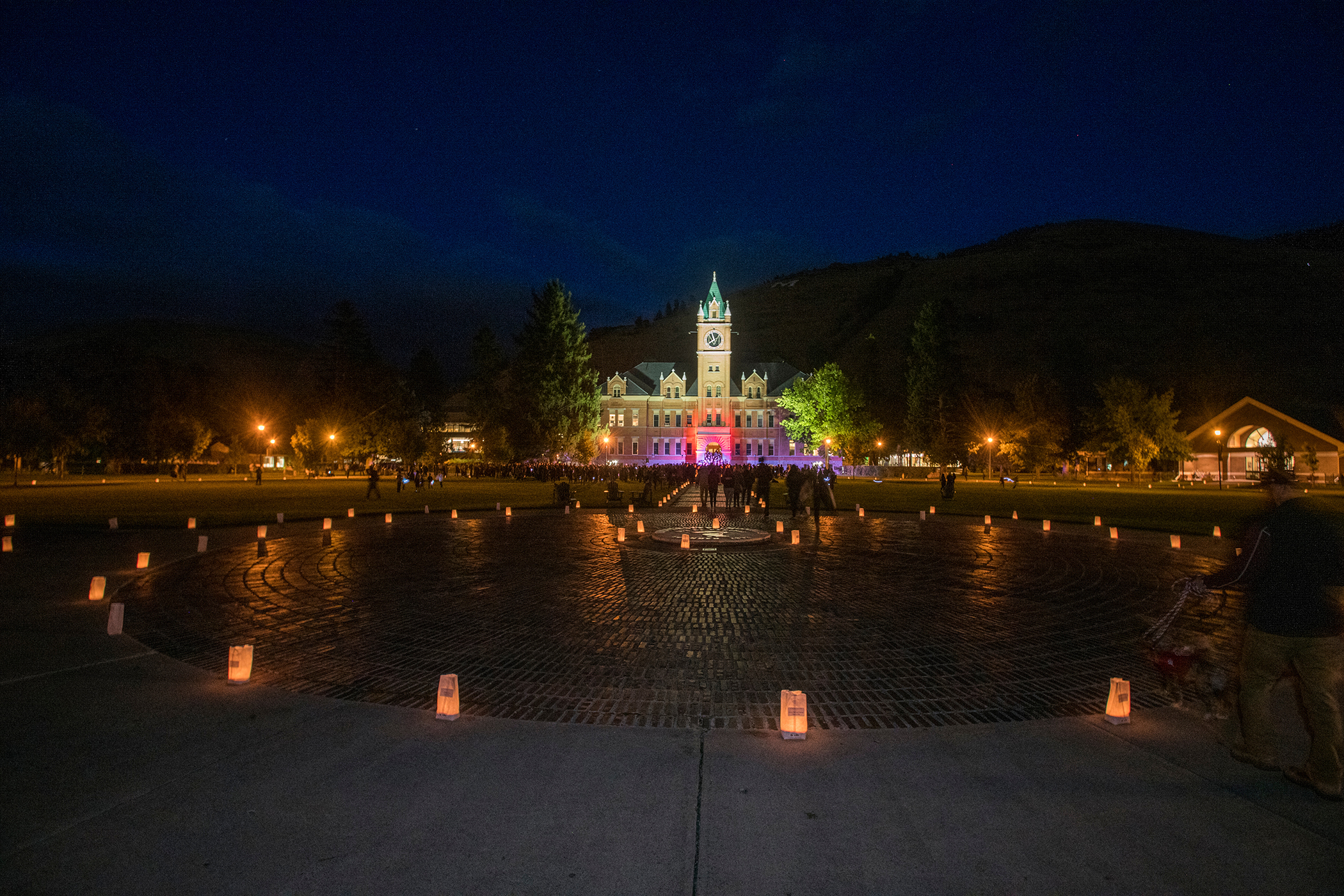 Photo of UM Oval with lumniaria around the perimeter.